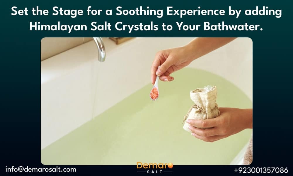 A person preparing a salt bath with Himalayan salt crystals.